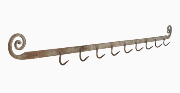 Wrought iron hook rack with a curled end and multiple hanging hooks, shown at a slight angle with one hook missing.