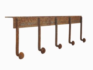 Industrial wall hook rail with five peg hooks and a top lip for mounting, shown in a distressed rusted finish.