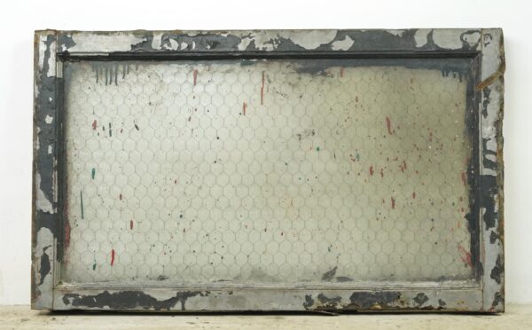 Rectangular reclaimed window with a wood frame and clear chicken wire glass, shown front on with chipped paint and worn surface edges.