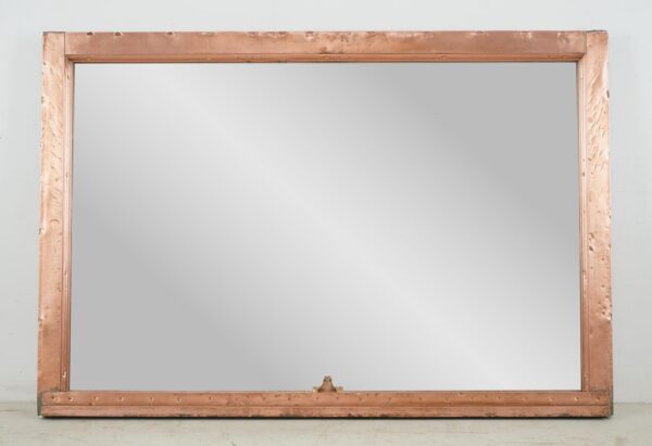 Copper window frame mirror with a polished finish and visible mounting wire attached to the back.