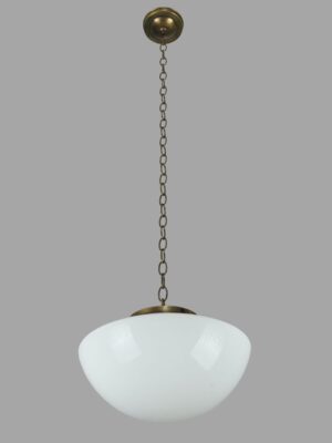 Schoolhouse pendant light with a white milk glass globe and antique brass chain fitter.