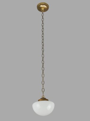 Schoolhouse pendant light with a white milk glass globe and antique brass chain fitter.