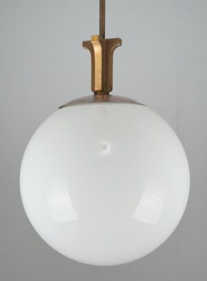 Art Deco pendant light with a white glass globe and brushed brass fitter.