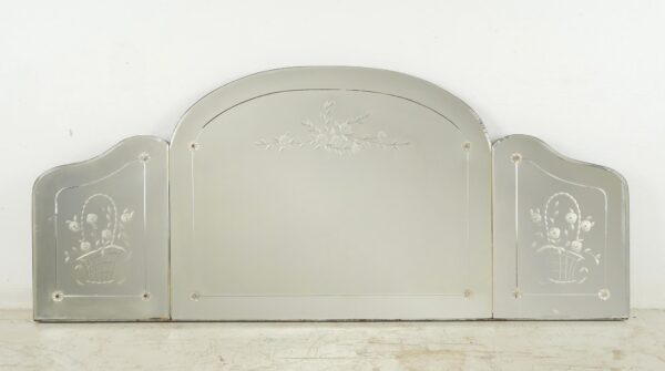 Traditional triptych wall mirror with three fixed panels, etched borders, and flower basket motifs, shown front view.