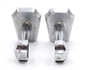 Pair of mid century towel bar brackets in nickel finish, shown as a matching pair with mounting screws visible and light surface wear.