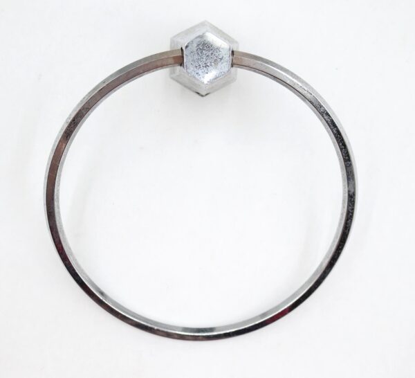 Vintage nickel-plated brass towel ring with a hexagonal wall mount and a simple circular hoop.