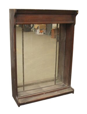 Mirror-backed tabletop showcase in dark wood tones with crown molding style upper trim and built-in shelf tracks, shown without shelves or brackets included.