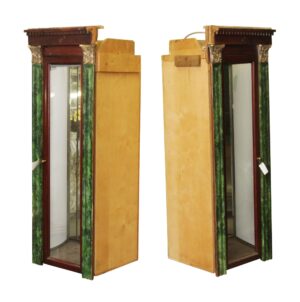 Pair of Neoclassical built-in display cabinets with mirrored fronts, green faux malachite-style columns, and wood sides shown together from the front and angled view.