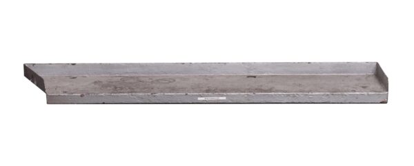 Slanted metal shelf piece with raised side and back lips, shown in a long angled view with a small label attached on the front edge.