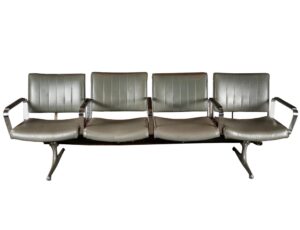 Four gray vinyl chairs ganged together on a chrome frame, shown in a front view with armrests and tapered legs visible.