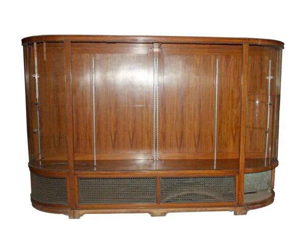 Freestanding showcase with curved glass sides, dark wood tone walnut frame, and bronze grilles at the base, shown with the front doors missing.