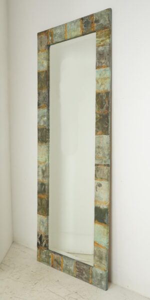 Tall dressing mirror with a handcrafted copper patchwork frame and beveled mirror glass.