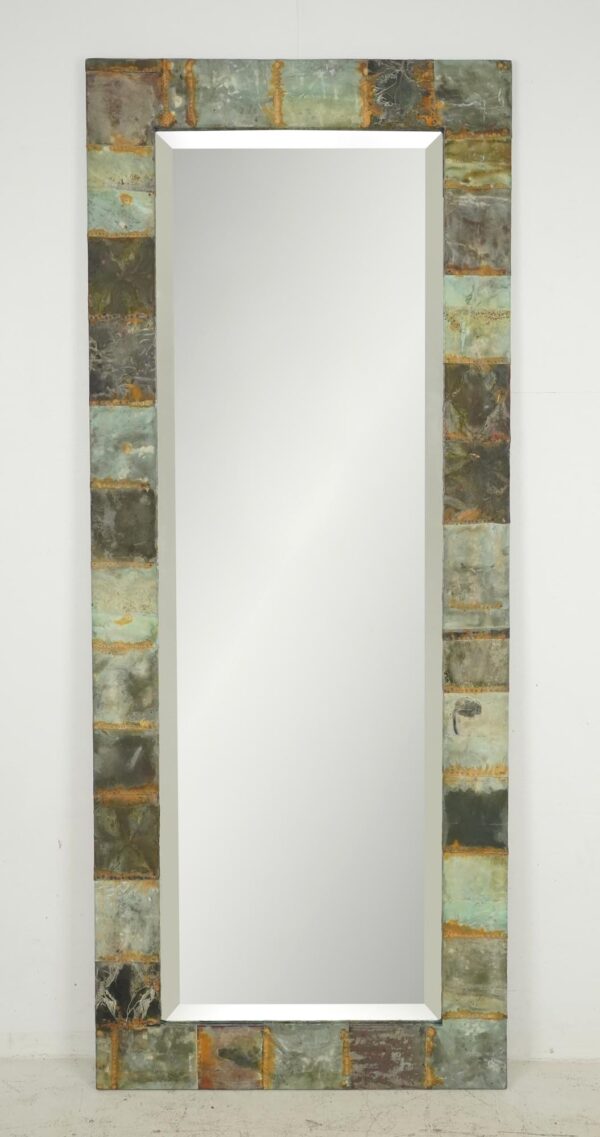 Tall dressing mirror with a handcrafted patchwork copper frame in verdigris tones and a beveled mirror inset.