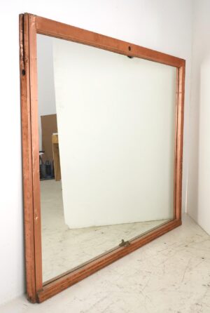 Large copper-framed mirror with a rectangular shape and visible top, side, and bottom rails.