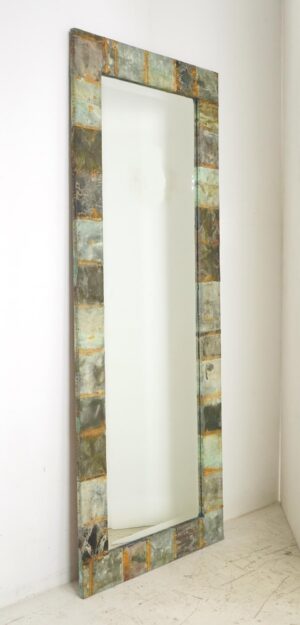 Full-length mirror with a handcrafted copper patchwork frame and beveled edge.