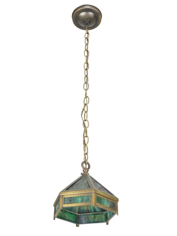 Arts and Crafts hexagonal pendant light with marbled green slag glass panels, brass framing, and a hanging chain.