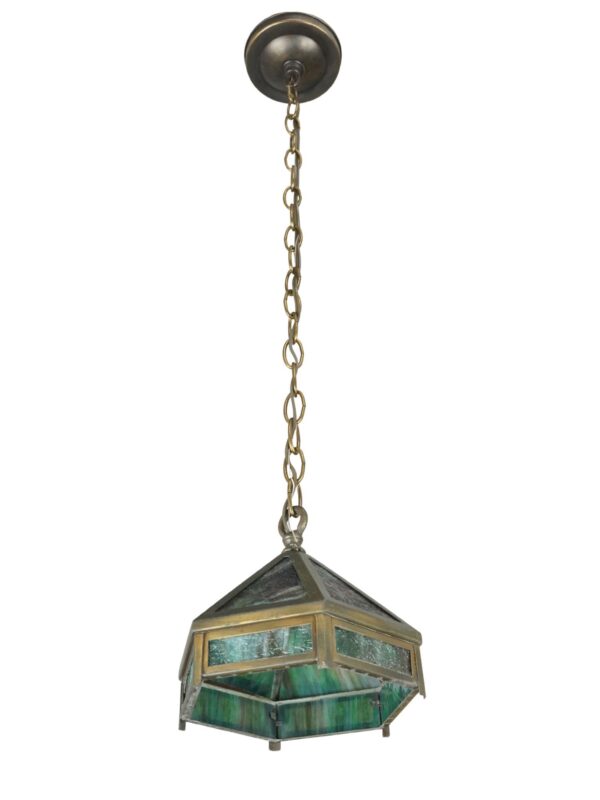Arts and Crafts hexagonal pendant light with marbled green slag glass panels, brass framing, and a hanging chain.