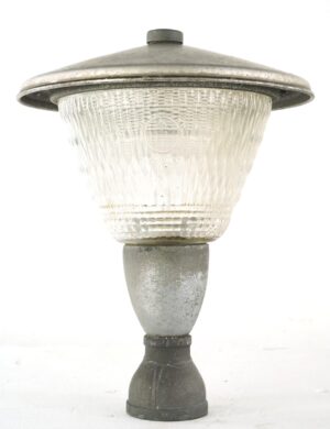 Exterior street lamp post top with clear Holophane glass, a wide brushed steel cap, and a bronze mounting base, shown front view.
