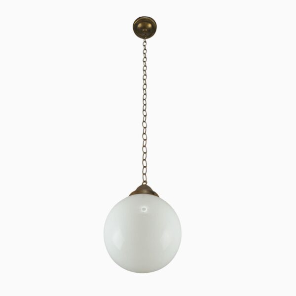 Schoolhouse pendant light with a round white glass globe and antique brass chain canopy.