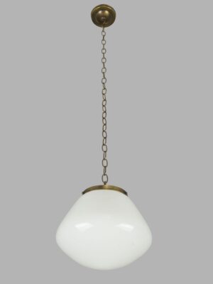 Schoolhouse pendant light with a milk glass globe and antique brass chain fitter.