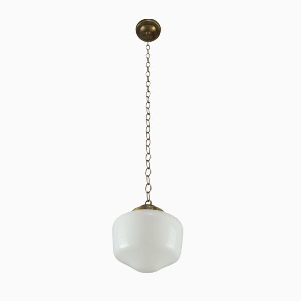 Schoolhouse pendant light with a milk glass globe, antique brass chain, and round ceiling canopy.