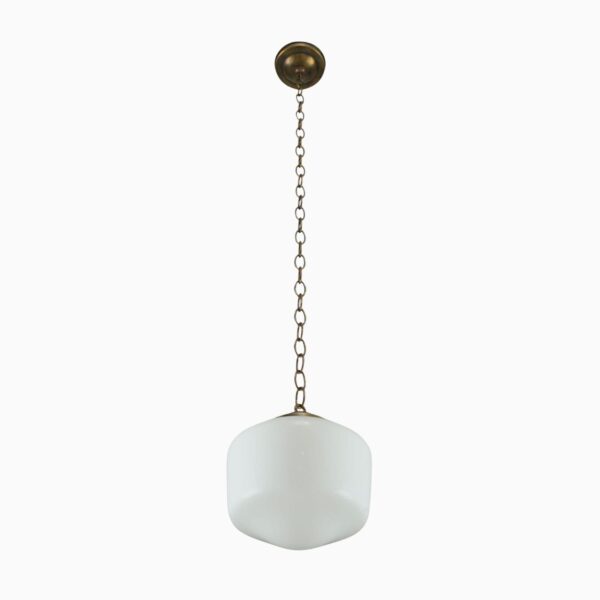 Schoolhouse pendant light with a milk glass globe and antique brass chain fitter.
