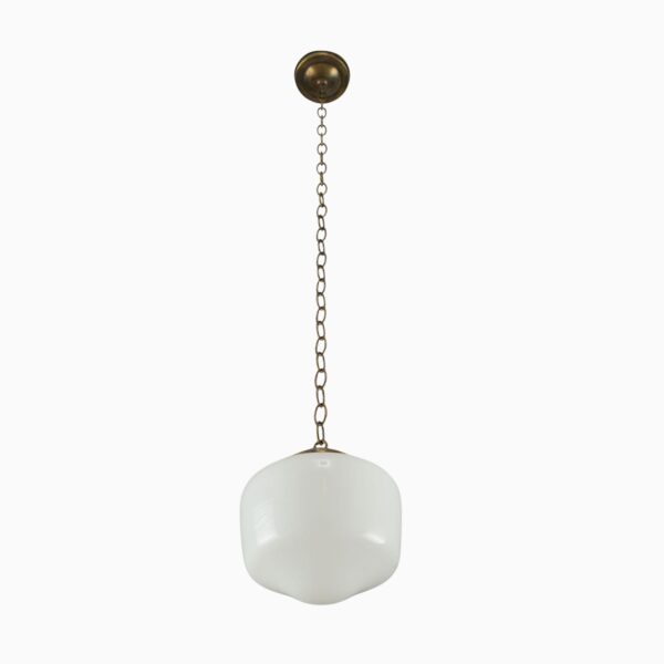 Schoolhouse pendant light with a white milk glass globe and an antique brass chain fitter.