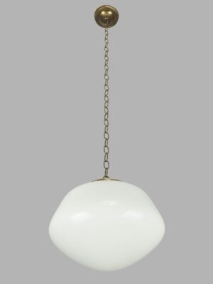 Schoolhouse pendant light with a white milk glass globe and antique brass chain fitter.