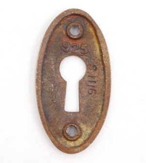 Vintage brass oval keyhole cover plate with two screw holes and a central keyhole opening.