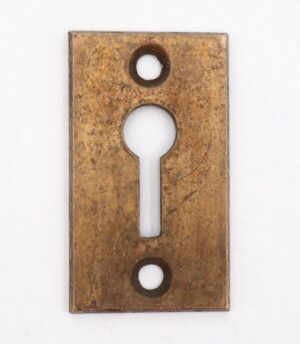 Vintage brass rectangular keyhole cover plate with a keyhole cutout and two screw holes.