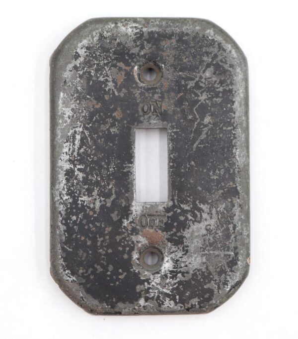 Distressed black steel toggle switch wall plate with a single rectangular opening and two screw holes.