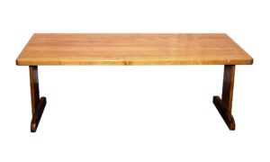 Medium wood tone coffee table with a smooth rectangular top and trestle base shown from the front.