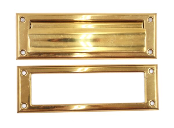 Two polished brass mail slot plates with rectangular openings and four mounting holes each, shown front and back.