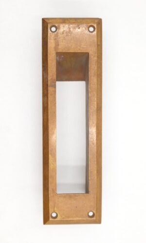 Vertical brass mail slot chute with a rectangular opening and four mounting holes, shown front on.