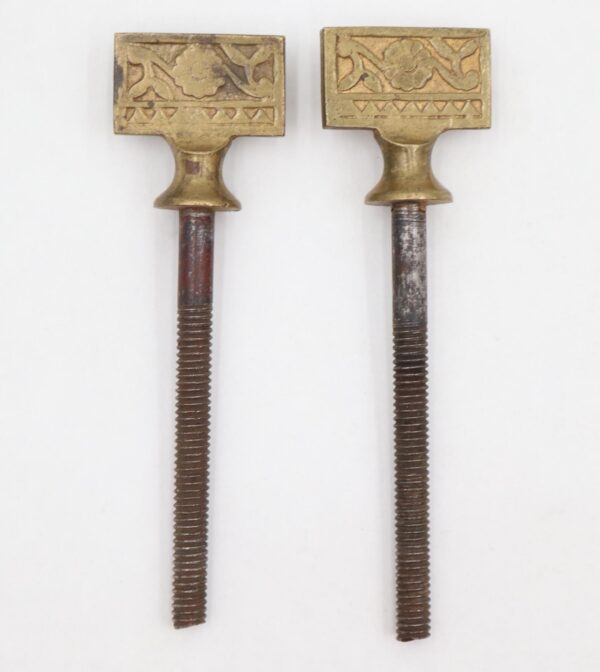 Pair of Eastlake mirror screws with brass knobs and steel threaded shafts, shown as a worn matching pair.