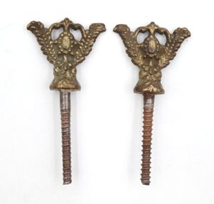 Pair of Victorian mirror screws with ornate brass knobs and steel threaded shafts, shown as a pair.