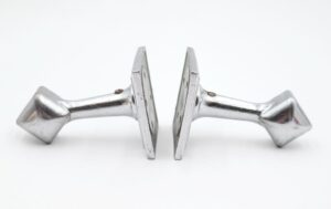Pair of Art Deco towel bar brackets in nickel-plated brass, shown as a matching pair with mounting screws included.