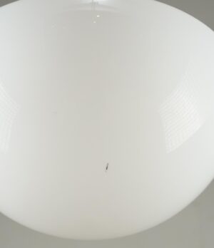 White milk glass schoolhouse pendant light globe with surface wear and a small black mark.