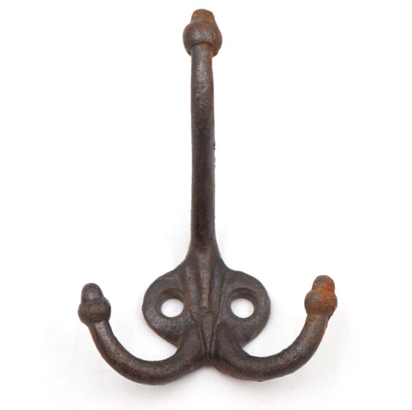 Vintage cast iron triple arm wall hook with acorn tips and two mounting holes, shown front view with surface wear and rust.