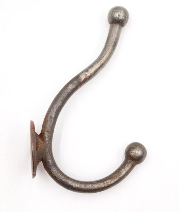 Vintage steel double arm wall hook with two curved arms and ball tips, shown from the side.