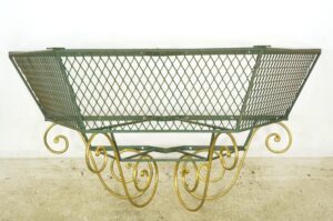 1940s French wrought iron console base with green frame and gold scrollwork legs shown in full front view.