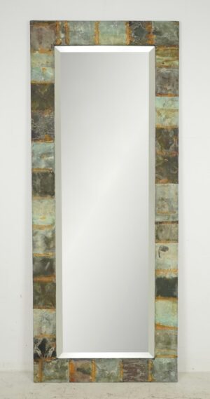 Close-up of tile frame texture showing green, brown, and rusty hues. Mirror angled to display thickness of the rustic, multicolored frame. Full-length mirror view against white wall showing weathered patterns on tiles. Detail shot focusing on corner joint with visible worn edges and varied tones.