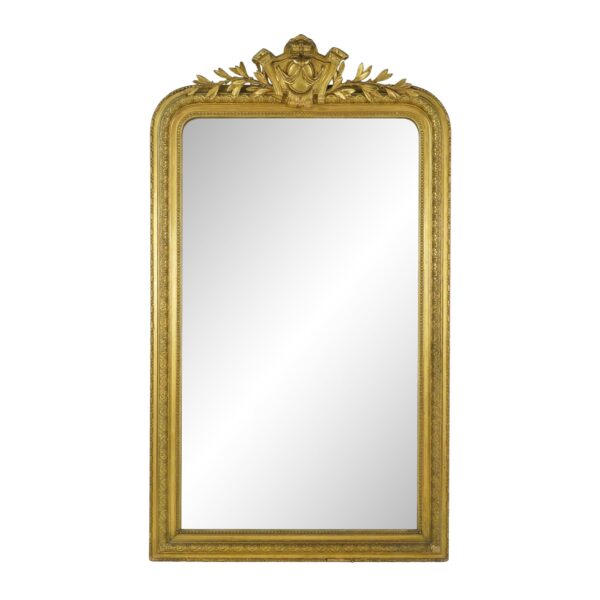 French Louis Philippe mirror with a giltwood frame, rounded upper corners, and an ornate crest at the top.