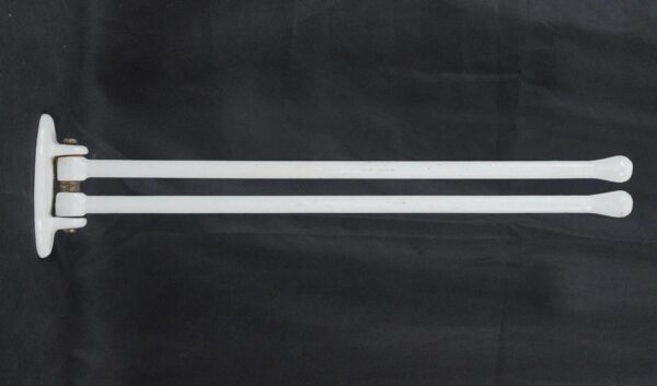 White mid century double arm towel rack with two long horizontal bars and a wall mount plate, shown in side view.