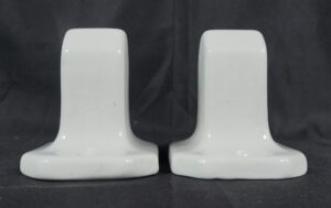 Pair of white ceramic towel bar brackets with a crackle porcelain finish, shown side by side.