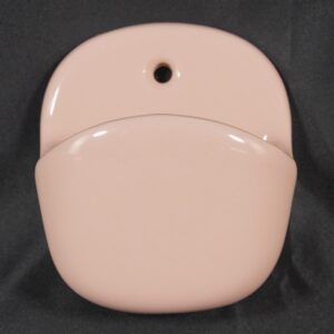 Pink ceramic wall-mounted soap dish with a rounded deep pocket and a single top mounting hole.