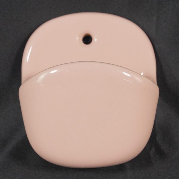 Pink ceramic wall-mounted soap dish with a rounded deep pocket and a single top mounting hole.