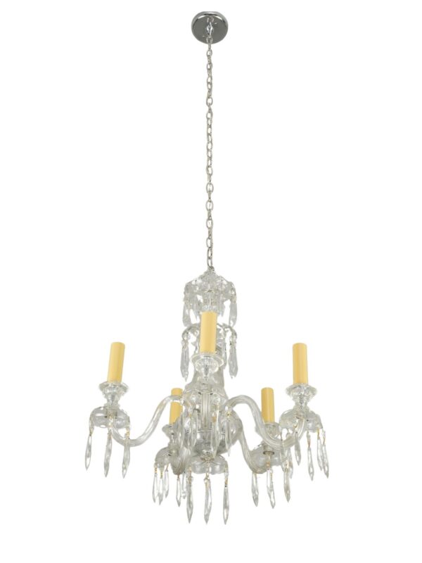 Traditional five-light crystal chandelier with curved glass arms, spear-shaped drops, and a long polished nickel chain.