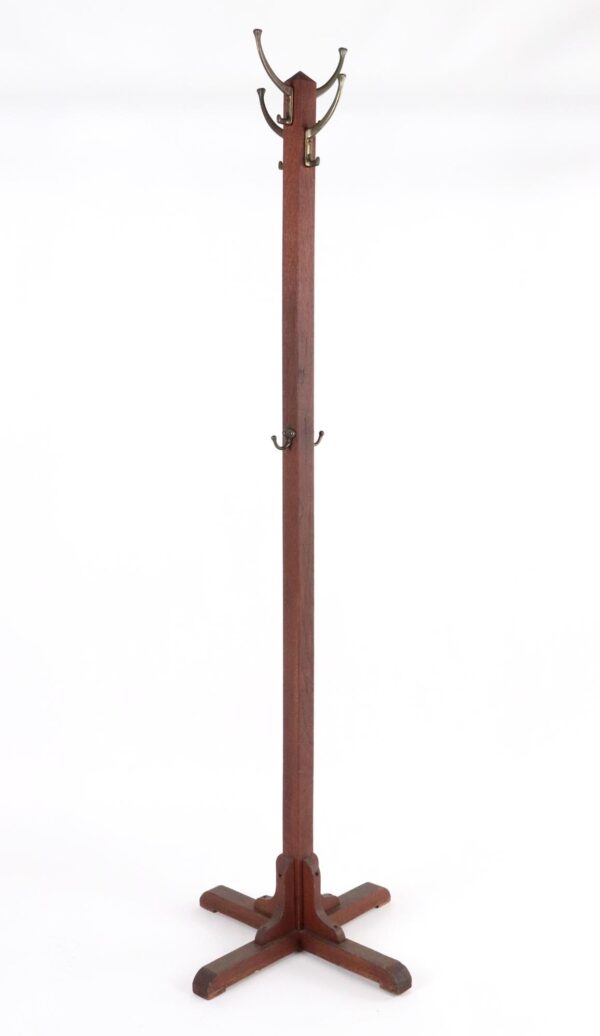A coat tree rack with a tall post, cross-base feet, four double hooks at the top, and two smaller hooks near the middle.