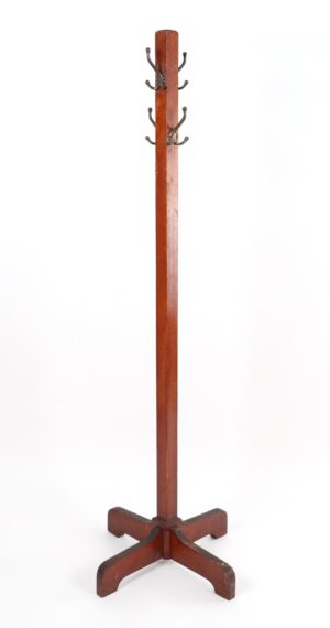 A freestanding coat rack with a quadripod base and four triple hooks at the top, shown in a dark wood tone with antique bronze hardware.